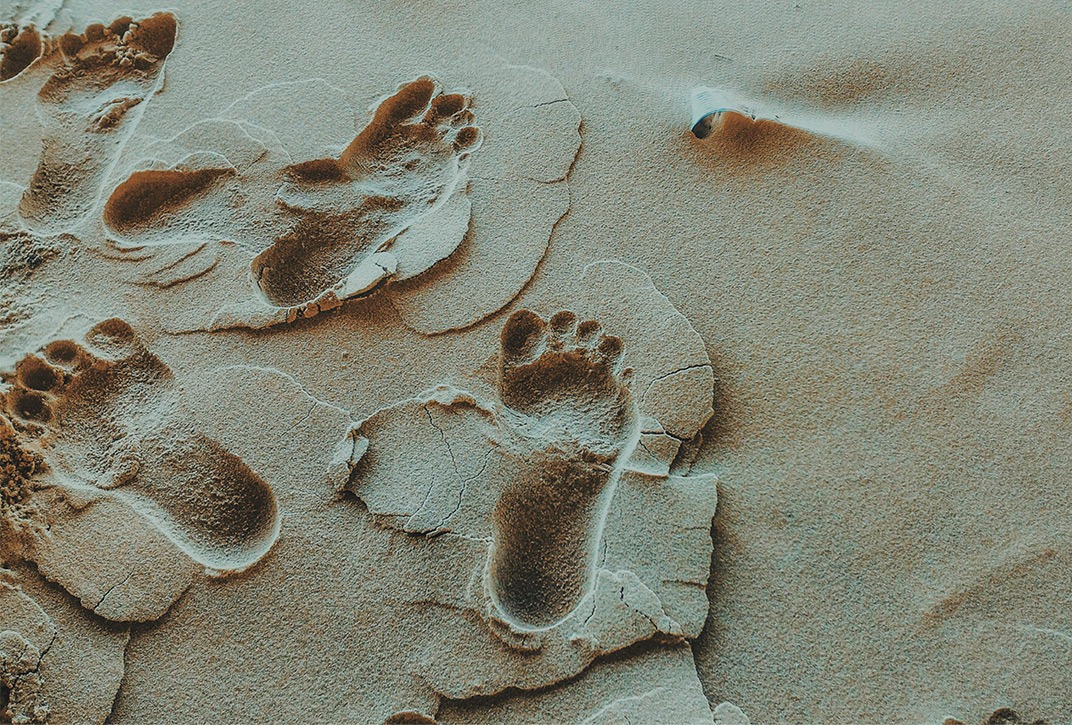 A close up of footprints in the sand